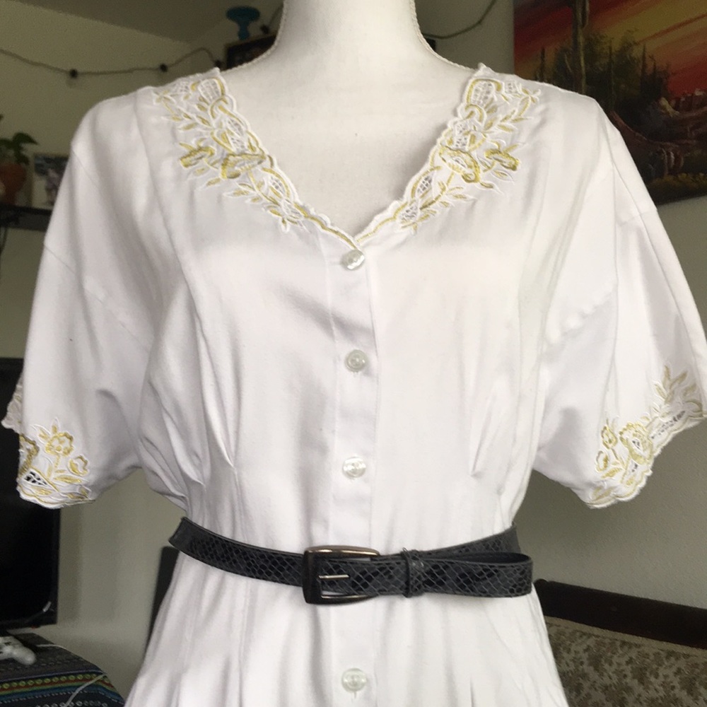 Black “snake/crocodile skin” belt w/ silver buckle